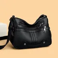 Classic black soft leather shoulder bag with multiple zippers and adjustable strap - Black