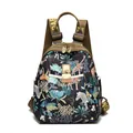 Women's travel backpack featuring vibrant tropical jungle prints and animal patterns - Forest Adventure Small
