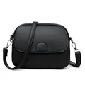 Mini black pebble leather crossbody bag with silver hardware and adjustable strap - Black