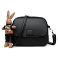 Mini round crossbody bag in black pebble leather with cute knit bunny charm - Black With Rabbit Pendant