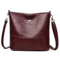 Deep burgundy leather bucket bag with silver kangaroo logo and adjustable shoulder strap - Burgundy