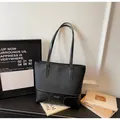 Large black faux leather tote bag with white contrast stitching and long shoulder straps - Black