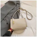 Minimalist beige crossbody bag with gold twist lock and fine leather texture - Standard Type / White