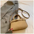 Chic light brown pebble leather square crossbody bag with handle and buckle accent - Grey Without Pendant