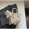 Elegant off-white leather bucket bag with gold hardware and a detachable strap - Standard Type / Off White