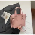 Elegant pink PU leather bucket bag with top handles and adjustable shoulder strap - Standard Type / Pink