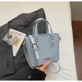 Minimalist light blue leather bucket bag with gold hardware and adjustable strap - Standard Type / Blue