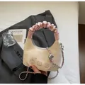 Chic cream dumpling bag with pink pleated handle and cartoon bear embroidery details - White and Pink