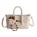 Chic cream white baguette bag in lychee pattern leather with golden clasp and cute charm - With Pendant / Off White
