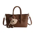 Minimalist dark brown baguette bag in pebbled leather with a cute bear charm and gold lock - With Pendant / Brown