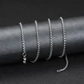Silver stainless steel box chain necklace with lobster clasp on a display stand - Corn Chain Style