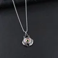 Punk-Dämonenauge-Halskette in Silber mit realistischer grüner Iris auf schwarzem Grund - Rosa