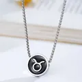 Macro shot of silver box chain with round black Taurus zodiac symbol pendant necklace - Taurus / Stainless Steel Pearl Chain / Silver