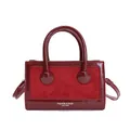 Burgundy baguette bag featuring glossy patent leather and suede patchwork design - Red