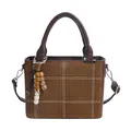 Retro warm brown suede handbag with cream lattice stitching and wooden bead charm - Brown