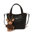 Elegant black litchi grain leather bucket bag with a cute plush bear charm and silver lock - With Bear Pendant / Black