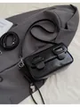 Minimalist black patent leather baguette bag with silver heart pendant and woven strap - Black With Pendant