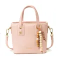 Sac seau rose chic avec perles décoratives en bois et détails métalliques dorés - Rose
