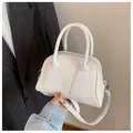 Minimalist white leather baguette bag with top handles and silver zipper detail - Off White