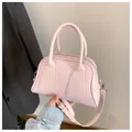 Light pink minimalist baguette bag with dual handles and adjustable shoulder strap - Pink