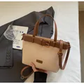 Retro beige bucket bag with brown handles and shoulder strap in a stylish tote design - Standard / Off White
