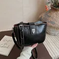 Chic black wrinkled leather crossbody bag with silver twist lock and brown trim edges - 22*7*15 / Black