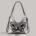 Silberne Hobo-Tasche mit schwarzer Schmetterlingsstickerei und Schnürbogendesign - Silber