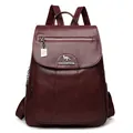 Chic burgundy faux leather backpack for women with pebbled texture and kangaroo charm - Burgundy