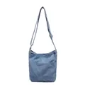 Sac seau élégant en denim bleu avec poches avant et bandoulière réglable - Bleu clair