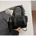 Black woven texture boston handbag with adjustable shoulder strap and gold hardware - Woven Style / Black