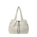White quilted puffer tote bag with drawstring closure and soft padded shoulder strap - White