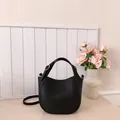Chic black litchi pattern leather bucket bag with silver hardware and top handle - Black
