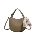 Khaki pebbled leather half-moon bucket bag with adjustable strap and plush bunny charm - Grey With Pendant