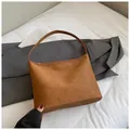 Brown woven leather hobo shoulder bag with classic intrecciato pattern for daily work - Brown