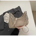 Chic beige faux leather shoulder bag with bold silver chain and adjustable strap - Off White