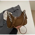 Brown leather crescent bag with chic silver chain strap and minimalist logo branding - Brown