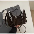 Deep brown matte suede dumpling bag with bold silver chain and adjustable strap - Coffee