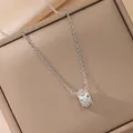 Elegant silver kaleidoscope pendant necklace with micro-pave crystals on a jewelry box - Kaleidoscope Necklace / Silver