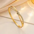 Luxurious gold-plated titanium knot bracelet with sparkling crystals for a minimalist style - Gold