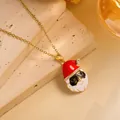 Macro shot of Santa Claus pendant with red enamel hat and gold chain on stone background - Gold - Santa Claus