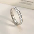 Macro shot of silver titanium steel half eternity ring featuring a row of round-cut crystals - Size 5 / Eternity Row Diamond Ring / Steel