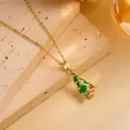 Detailed macro view of golden Christmas tree pendant with green enamel and colorful crystals - Gold - Multicolor Zircon Christmas Tree