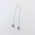 Detail of silver butterfly tassel drop earrings with frosted and shimmering finish texture - 5546 Butterfly Ear Thread / Steel