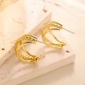 Macro detail of triple layer gold titanium steel earrings with hammered texture and mirror finish - Honeycomb Hammered Triple Ring Style (ED037) / Gold