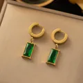 Macro detail of emerald-green rectangular drop earrings in 18k gold-plated finish - ED3073J Green Zirconia Earrings (ED3073J) / Gold