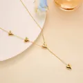 Detailed view of a gold Y-shaped heart necklace with polished heart-shaped pendants - Multi-Heart Necklace (XL8088J) / Gold