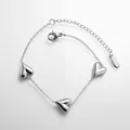 Detail of silver heart charm bracelet with adjustable chain and polished metallic finish - Triple Heart Bracelet (SL5088Y) / Steel