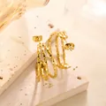 Three-line twisted geometric gold titanium steel hoop earrings with a textured finish - Gold