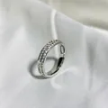 Detailed shot of double-row pavé crystals on a polished silver titanium steel ring - Size 5 / Steel