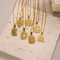Golden alphabet necklaces A-G with textured pendants on minimalist gold chains - Letter A